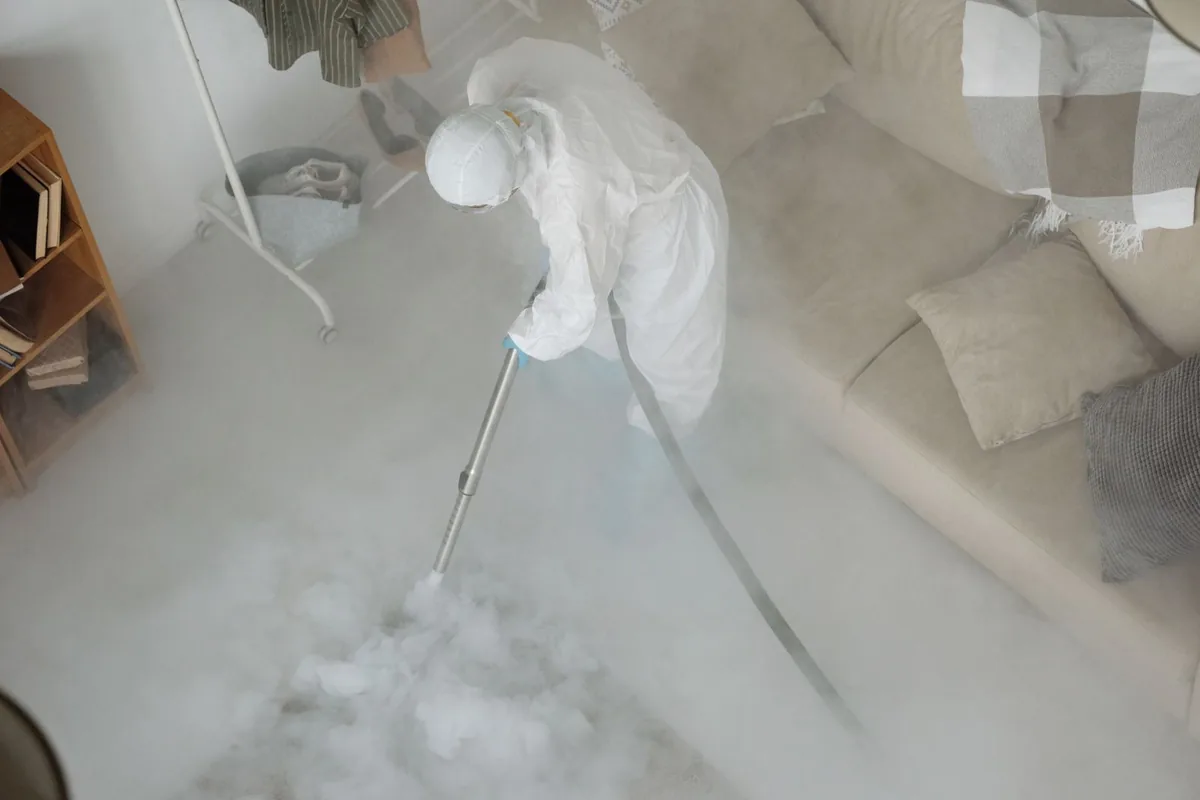 Biohazard cleanup technician in protective equipment, Madison, ME